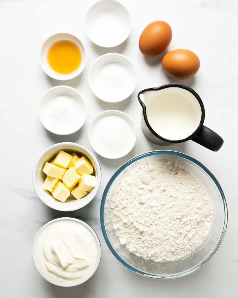 Ingredients required: plain (all purpose) flour, granulated sugar, baking powder, bicarbonate of soda (baking soda) salt, yogurt, milk, eggs, vanilla and butter. Recipe by movers and bakers