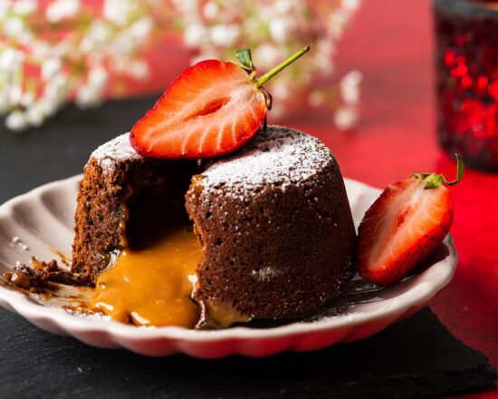 These caramel lava cakes have a beautiful salted caramel filling that is just to die for, encased in a light and delicious chocolate cake. Serve with some fresh berries and a scoop of ice cream for pure dessert heaven! Recipe by movers and bakers
