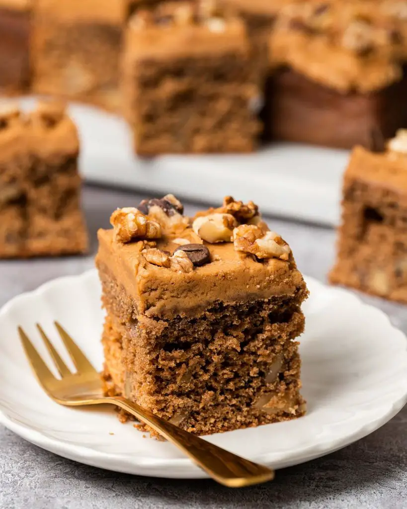 My coffee and walnut traybake is an incredibly moreish bake, with a light and fluffy coffee sponge cake dotted with walnuts throughout, topped with a silky coffee buttercream and decorated with more walnuts and coffee beans. Perfect for feeding a crowd! Recipe by movers and bakers
