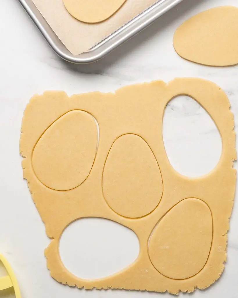 Stamping out the shapes before baking the biscuits. Recipe by movers and bakers