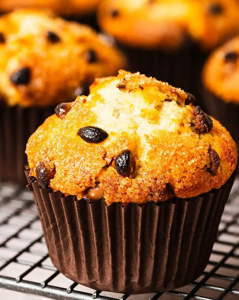 Chocolate chips muffins. Perfectly light and fluffy bakery style vanilla muffins with plenty of chocolate chips throughout and a crunchy sugar crust. Recipe by movers and bakers