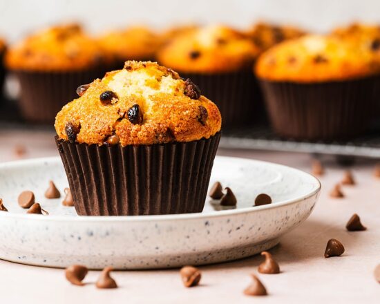 Chocolate chips muffins. Perfectly light and fluffy bakery style vanilla muffins with plenty of chocolate chips throughout and a crunchy sugar crust. Recipe by movers and bakers