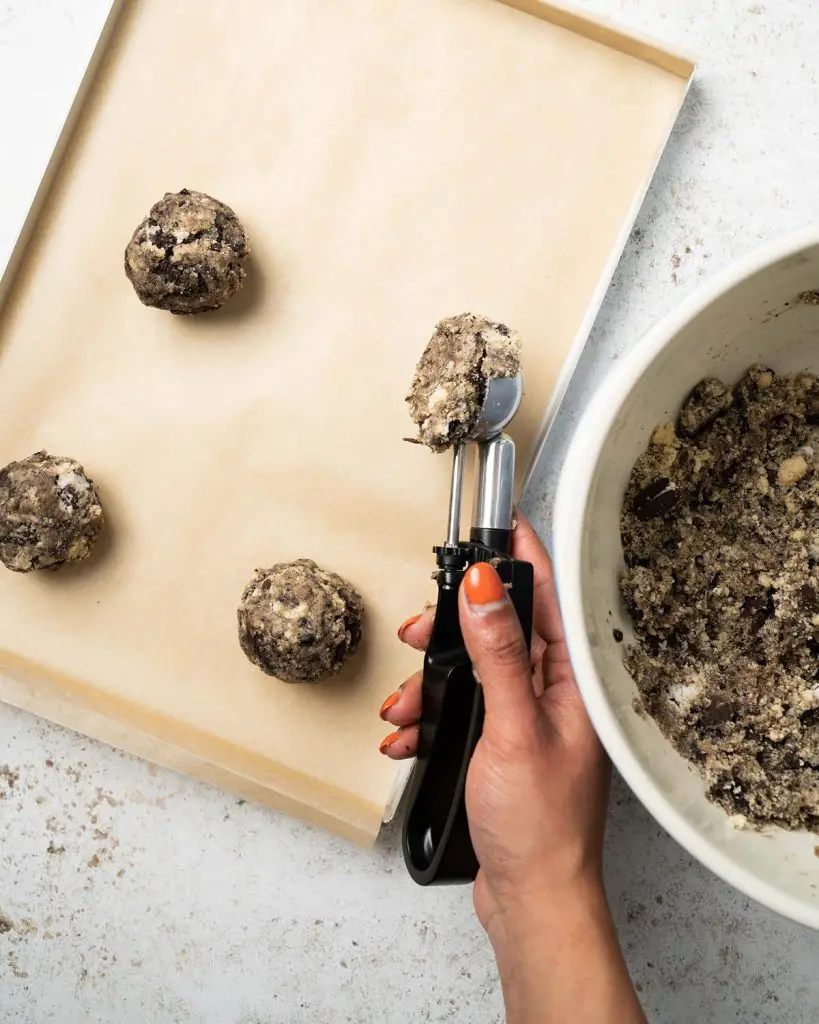 Scooping the dough into balls and chilling before baking. Recipe by movers and bakers