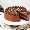 My eggless chocolate cake is light, moist and deeply chocolatey with a smooth chocolate buttercream and crowned with sprinkles. This cake is so good, no one will know it is egg free! Recipe by movers and bakers