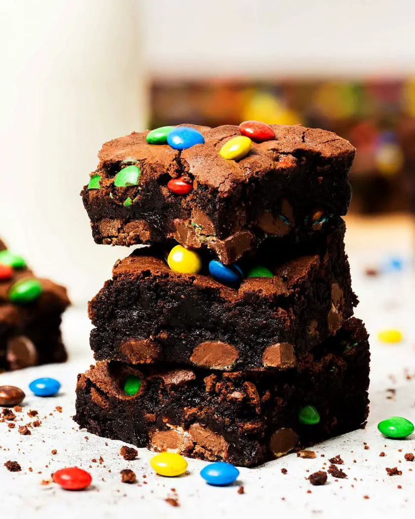 My M&M brownies are chunky and chewy and perfectly decadent, packed with plenty of M&Ms inside and on top. A perfect, fun brownie treat! Recipe by movers and bakers