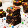 My M&M brownies are chunky and chewy and perfectly decadent, packed with plenty of M&Ms inside and on top. A perfect, fun brownie treat! Recipe by movers and bakers