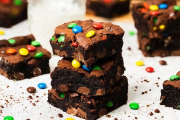 My M&M brownies are chunky and chewy and perfectly decadent, packed with plenty of M&Ms inside and on top. A perfect, fun brownie treat! Recipe by movers and bakers