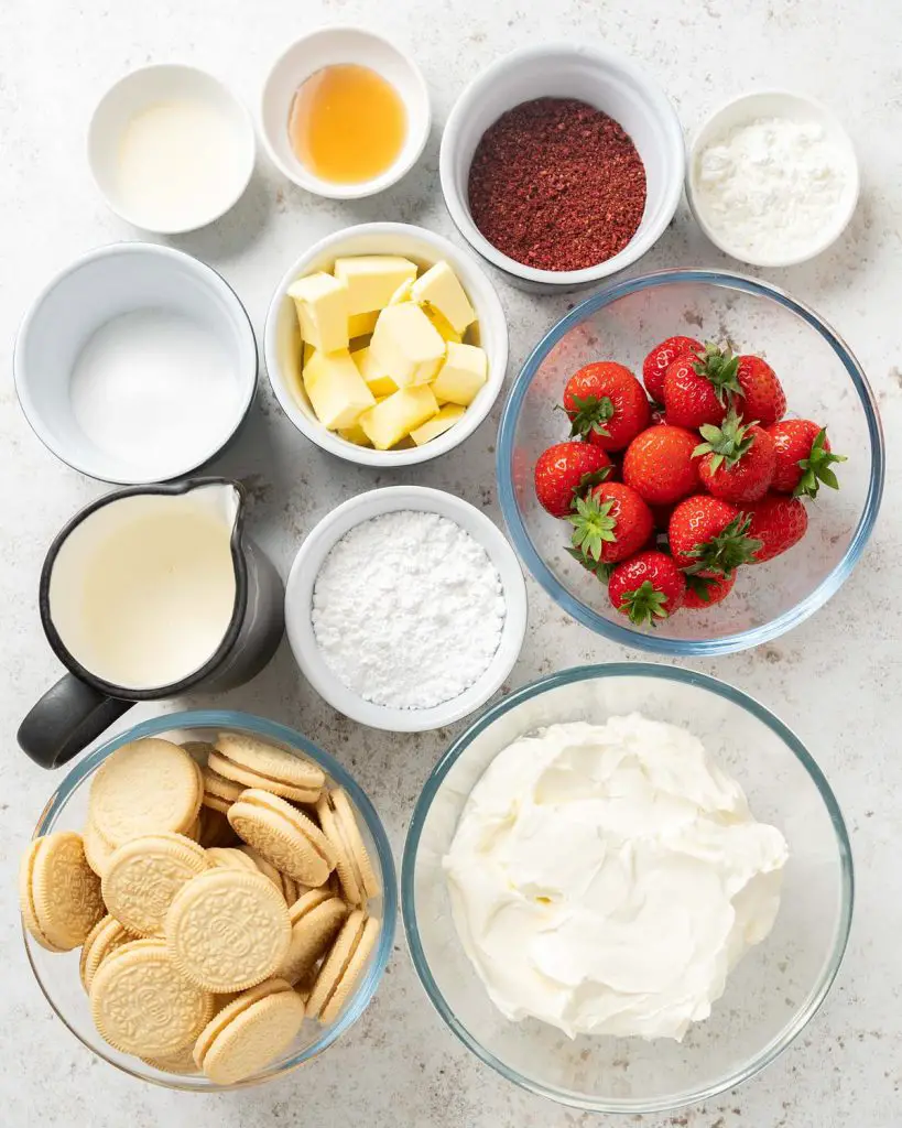 Ingredients required: golden oreos, freeze dried strawberries, unsalted butter, cream cheese, icing (powdered) sugar, vanilla, double (heavy) cream, fresh strawberries, caster sugar, lemon juice and cornflour (cornstarch). Recipe by movers and bakers