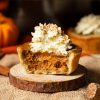 My mini pumpkin pies have a thin buttery shortcrust pastry shell and a deliciously autumnal pumpkin pie filling. Topped with a swirl of whipped cream and dusted with pumpkin spice, this is one dessert everyone will love! Recipe by movers and bakers