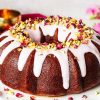 My gulab jamun cake is moist and flavourful and so utterly irresistible! It has an eggless cardamom cake, a deep cardamom and rose water syrup and a pretty pink glaze decorated with chopped pistachios and dried rose petals. The prettiest celebration cake! Recipe by movers and bakers