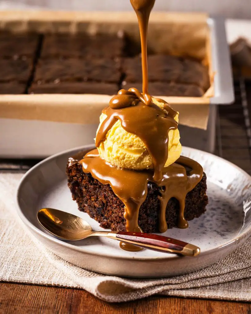 Sticky toffee pudding is a British classic dessert. It has a rich dark date sponge and a gloriously decadent toffee sauce. Enjoy warm with ice cream, cream or custard. Recipe by movers and bakers