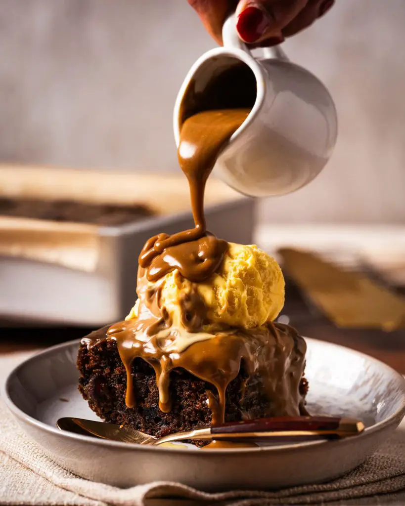 Sticky toffee pudding is a British classic dessert. It has a rich dark date sponge and a gloriously decadent toffee sauce. Enjoy warm with ice cream, cream or custard. Recipe by movers and bakers