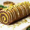 My viral Dubai chocolate brownie yule log has a soft and squidgy brownie layer swirled with a pistachio kataifi filling. Topped with milk chocolate and decorated with a chocolate and pistachio drizzle, this gorgeous dessert is sure to wow all your guests! Recipe by movers and bakers