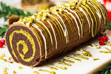 My viral Dubai chocolate brownie yule log has a soft and squidgy brownie layer swirled with a pistachio kataifi filling. Topped with milk chocolate and decorated with a chocolate and pistachio drizzle, this gorgeous dessert is sure to wow all your guests! Recipe by movers and bakers