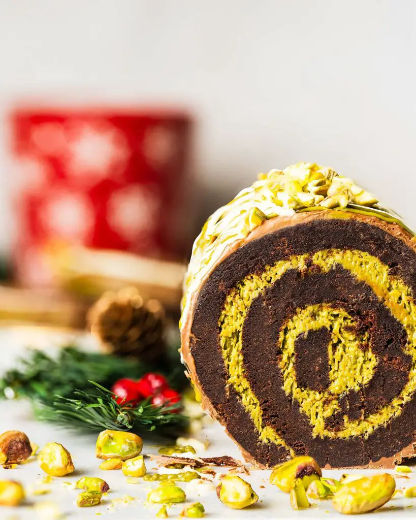 My viral Dubai chocolate brownie yule log has a soft and squidgy brownie layer swirled with a pistachio kataifi filling. Topped with milk chocolate and decorated with a chocolate and pistachio drizzle, this gorgeous dessert is sure to wow all your guests! Recipe by movers and bakers