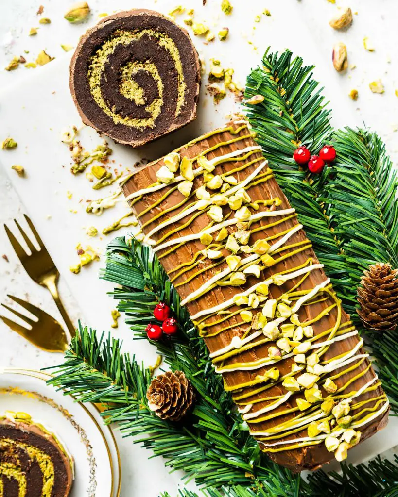 My viral Dubai chocolate brownie yule log has a soft and squidgy brownie layer swirled with a pistachio kataifi filling. Topped with milk chocolate and decorated with a chocolate and pistachio drizzle, this gorgeous dessert is sure to wow all your guests! Recipe by movers and bakers