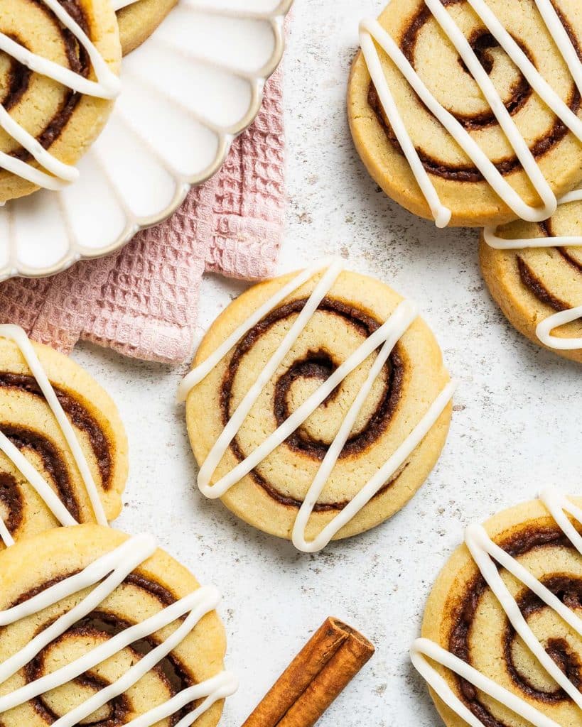 Who doesn't love cookies and cinnamon rolls! So when craving them both, why not put them together! And so my cinnamon roll cookies were born! Recipe by movers and bakers