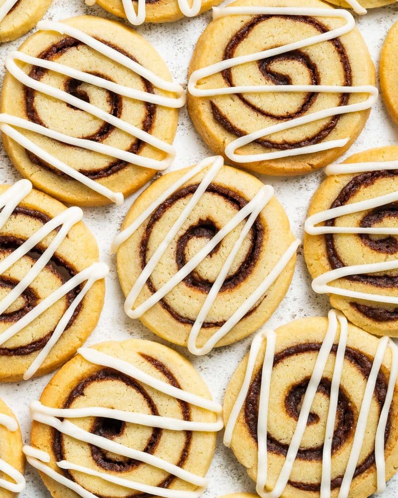 Who doesn't love cookies and cinnamon rolls! So when craving them both, why not put them together! And so my cinnamon roll cookies were born! Recipe by movers and bakers