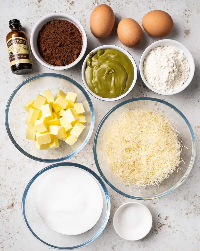 For the brownie and pistachio filling: unsalted butter, cocoa powder, vanilla, eggs, caster sugar, plain (all purpose) flour, salt, Kataifi pastry and pistachio cream. Recipe by movers and bakers