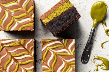 My viral Dubai pistachio chocolate brownies are just so good! With a chewy brownie base, a crunchy pistachio kunafe filling and a pretty feathered chocolate layer to finish, these beautiful squares of joy are really hard to resist! Recipe by movers and bakers