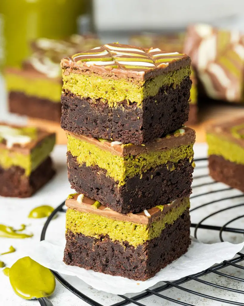 My viral Dubai pistachio chocolate brownies are just so good! With a chewy brownie base, a crunchy pistachio kunafe filling and a pretty feathered chocolate layer to finish, these beautiful squares of joy are really hard to resist! Recipe by movers and bakers