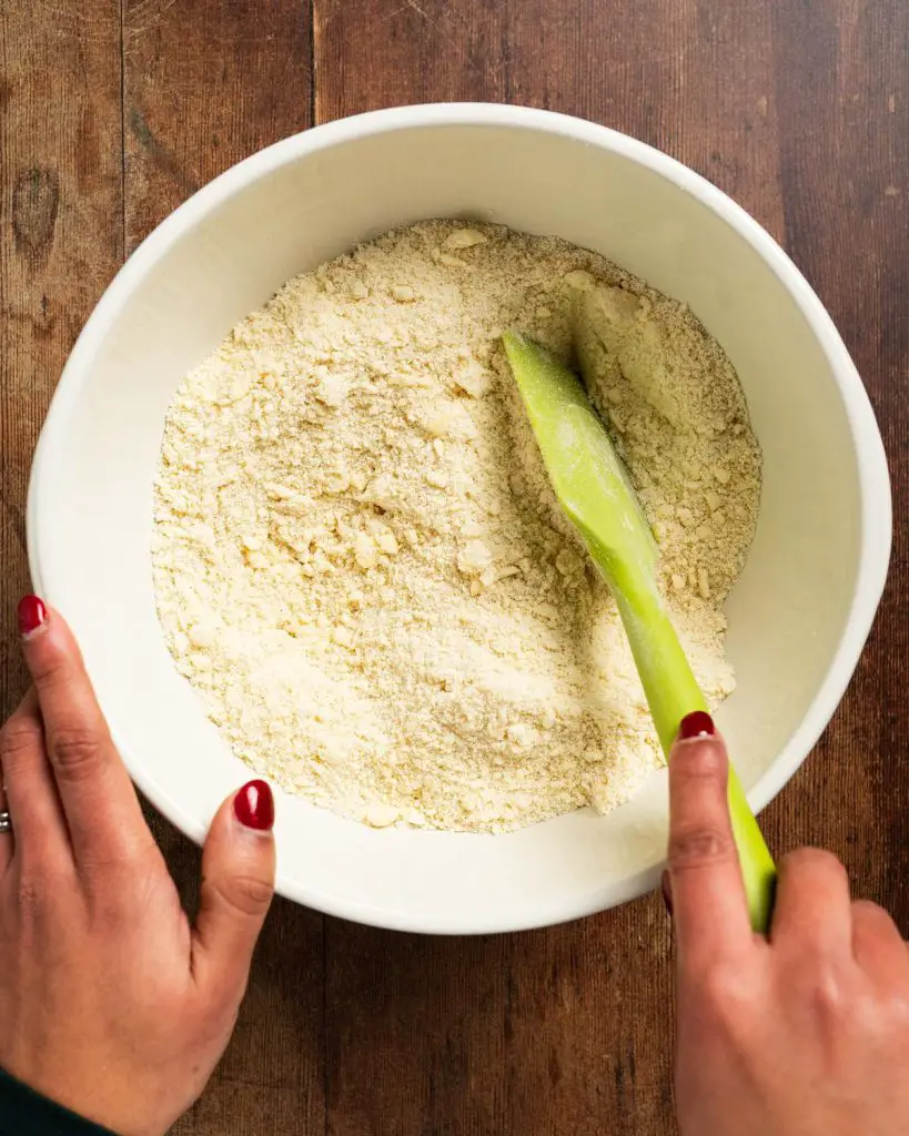 Before adding in the flour and salt and combining until it clumps together...