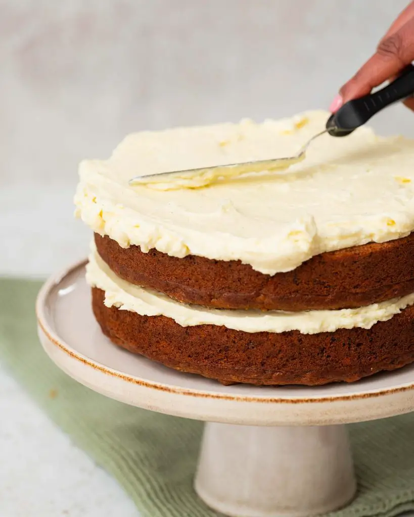 Building up the cake layers with icing in between, and on the top and sides...