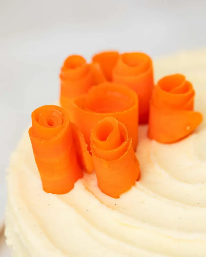 Arrange the carrot roses on top in any decorative way you prefer. Finish with a little bit of green (I used some dill). Recipe by movers and bakers