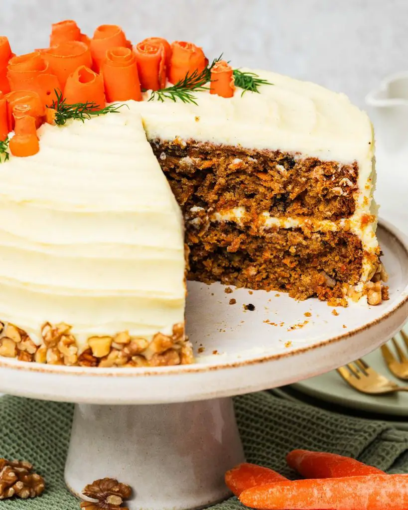 My all time favourite carrot cake recipe is so simple and easy! Deliciously light, fluffy and moist carrot cake layers, gently and perfectly spiced, are covered with a wonderful cream cheese icing. Recipe by movers and bakers