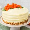 My all time favourite carrot cake recipe is so simple and easy! Deliciously light, fluffy and moist carrot cake layers, gently and perfectly spiced, are covered with a wonderful cream cheese icing. Recipe by movers and bakers