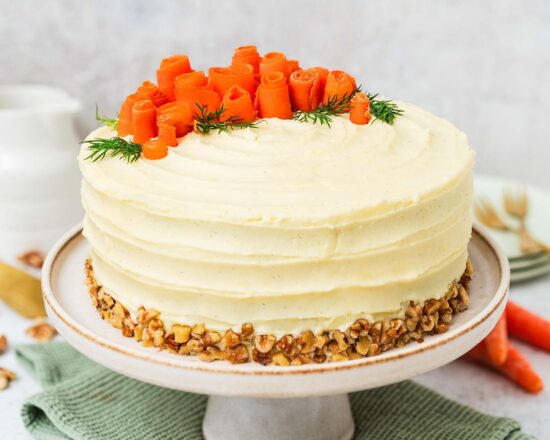 My all time favourite carrot cake recipe is so simple and easy! Deliciously light, fluffy and moist carrot cake layers, gently and perfectly spiced, are covered with a wonderful cream cheese icing. Recipe by movers and bakers