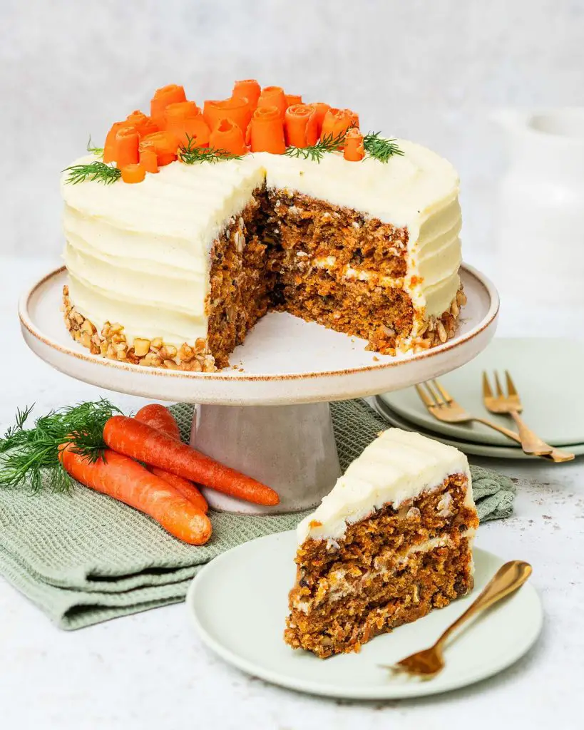 My all time favourite carrot cake recipe is so simple and easy! Deliciously light, fluffy and moist carrot cake layers, gently and perfectly spiced, are covered with a wonderful cream cheese icing. Recipe by movers and bakers