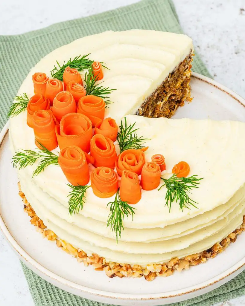 My all time favourite carrot cake recipe is so simple and easy! Deliciously light, fluffy and moist carrot cake layers, gently and perfectly spiced, are covered with a wonderful cream cheese icing. Recipe by movers and bakers