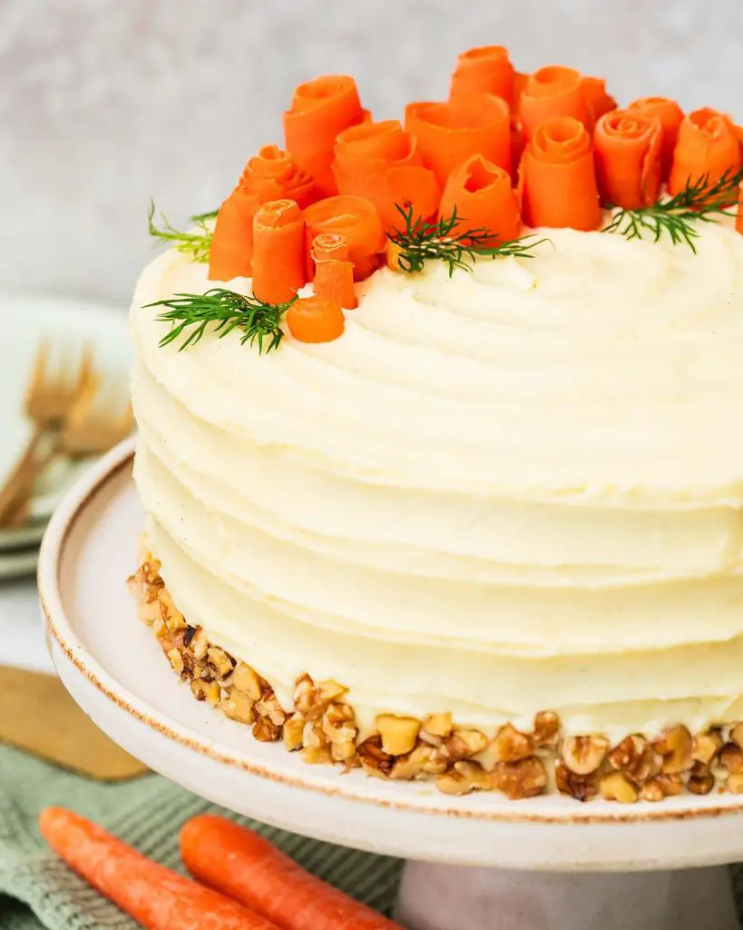 My all time favourite carrot cake recipe is so simple and easy! Deliciously light, fluffy and moist carrot cake layers, gently and perfectly spiced, are covered with a wonderful cream cheese icing. Recipe by movers and bakers