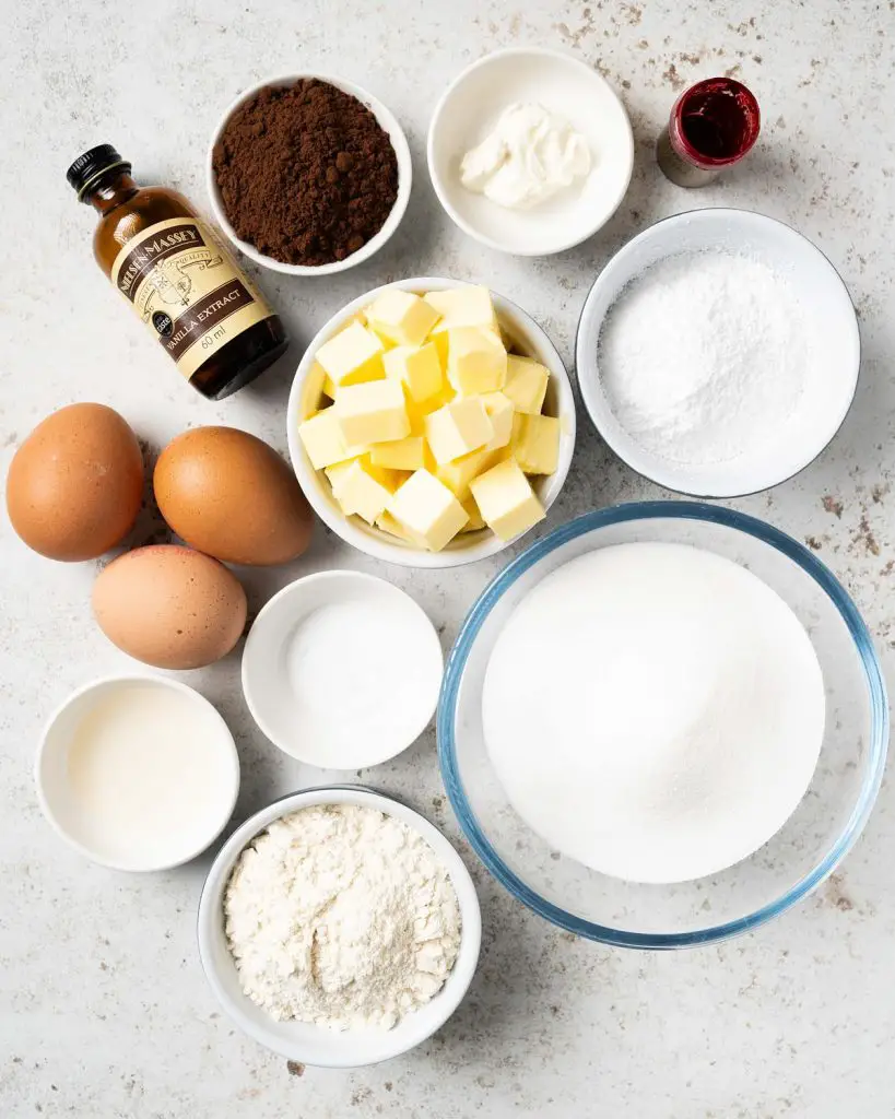 Ingredients required: unsalted butter, cocoa powder, vanilla, caster sugar, eggs, vinegar, red food colouring, plain (all purpose) flour, salt, cream cheese and icing sugar. Recipe by movers and bakers