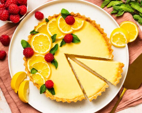 My lemon tart, or tarte au citron, has a creamy bright lemon custard filling encased in a beautiful buttery pastry. An elegant French classic! Recipe by movers and bakers