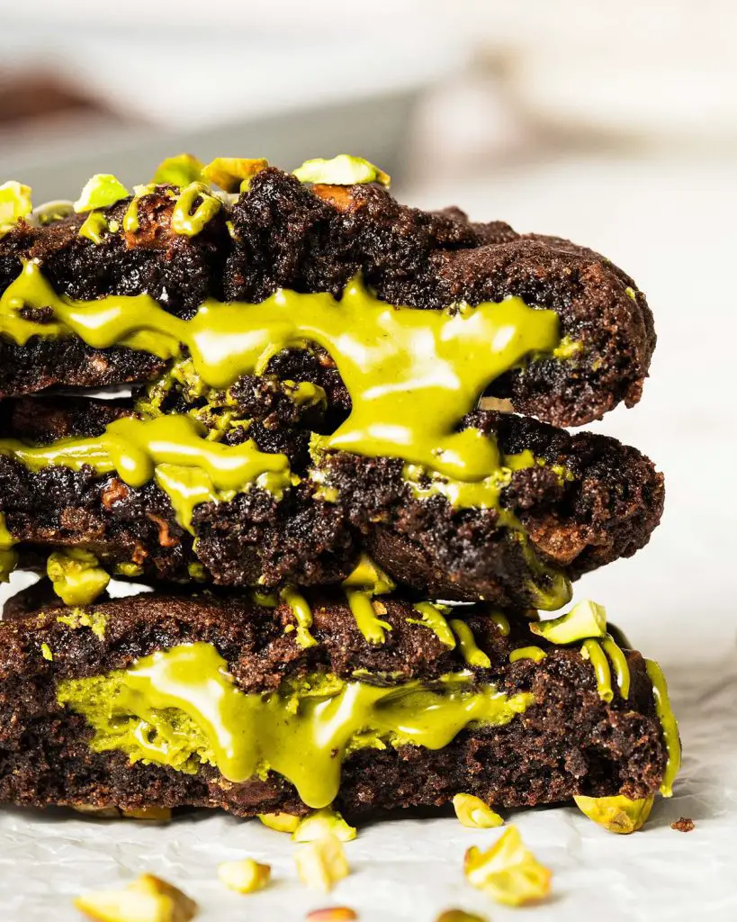 Pistachio chocolate chip cookies are chunky, chewy, chocolatey and so utterly heavenly! Filled with a generous stuffing of smooth pistachio cream, these cookies are utterly out-of-this-world decadent! Recipe by movers and bakers