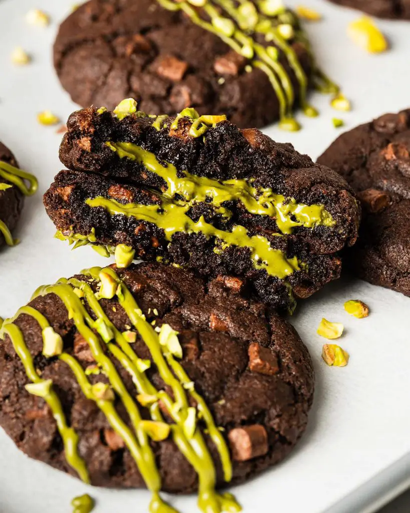 Pistachio chocolate chip cookies are chunky, chewy, chocolatey and so utterly heavenly! Filled with a generous stuffing of smooth pistachio cream, these cookies are utterly out-of-this-world decadent! Recipe by movers and bakers