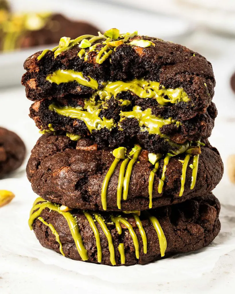 Pistachio chocolate chip cookies are chunky, chewy, chocolatey and so utterly heavenly! Filled with a generous stuffing of smooth pistachio cream, these cookies are utterly out-of-this-world decadent! Recipe by movers and bakers