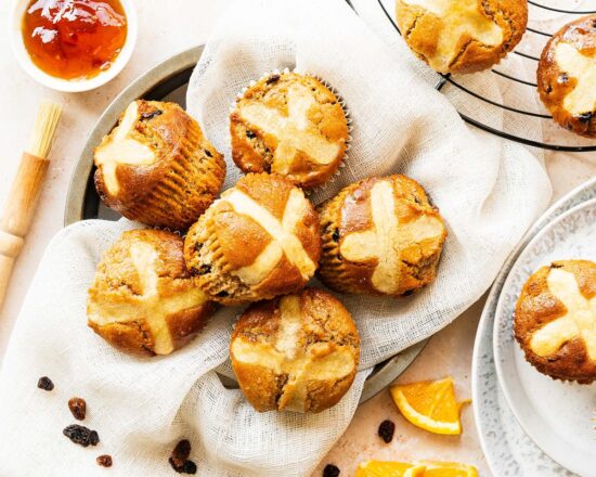 My hot cross bun muffins are a delicious (and quick!) Easter treat, perfectly combining muffins with the spices, dried fruit and citrus flavours of the traditional Easter favourite. Recipe by movers and bakers