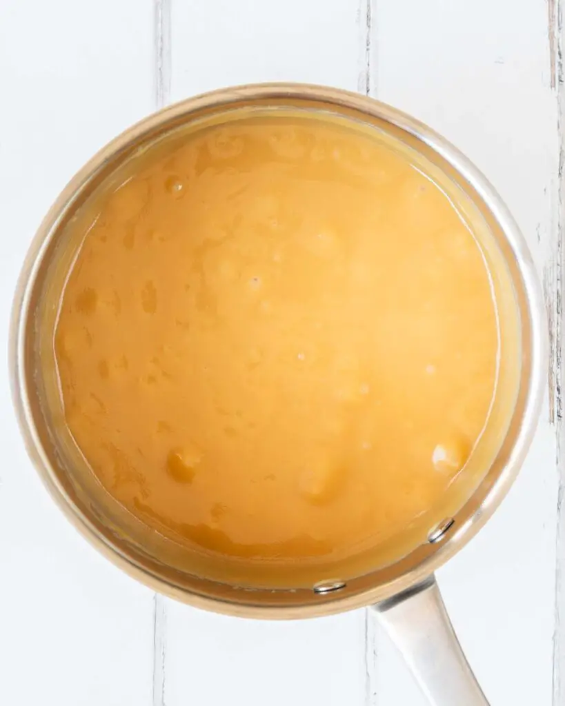 Cook until the caramel is a rich golden colour before pouring over the base. Recipe by movers and bakers