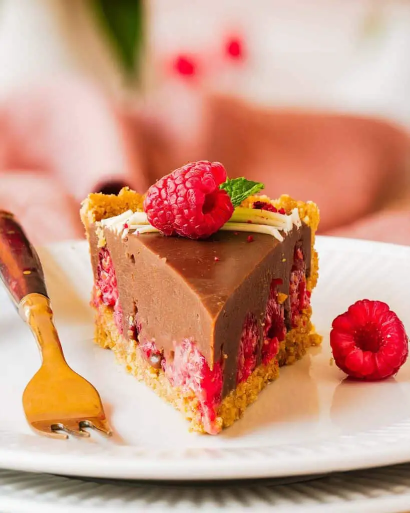My chocolate raspberry tart is the perfect dessert for sophisticated and elegant entertaining, but with minimal and easy prep! Buttery biscuit base, fresh tart raspberries and a smooth and creamy milk chocolate filling make this a dreamy dessert everyone will love. Recipe by movers and bakers