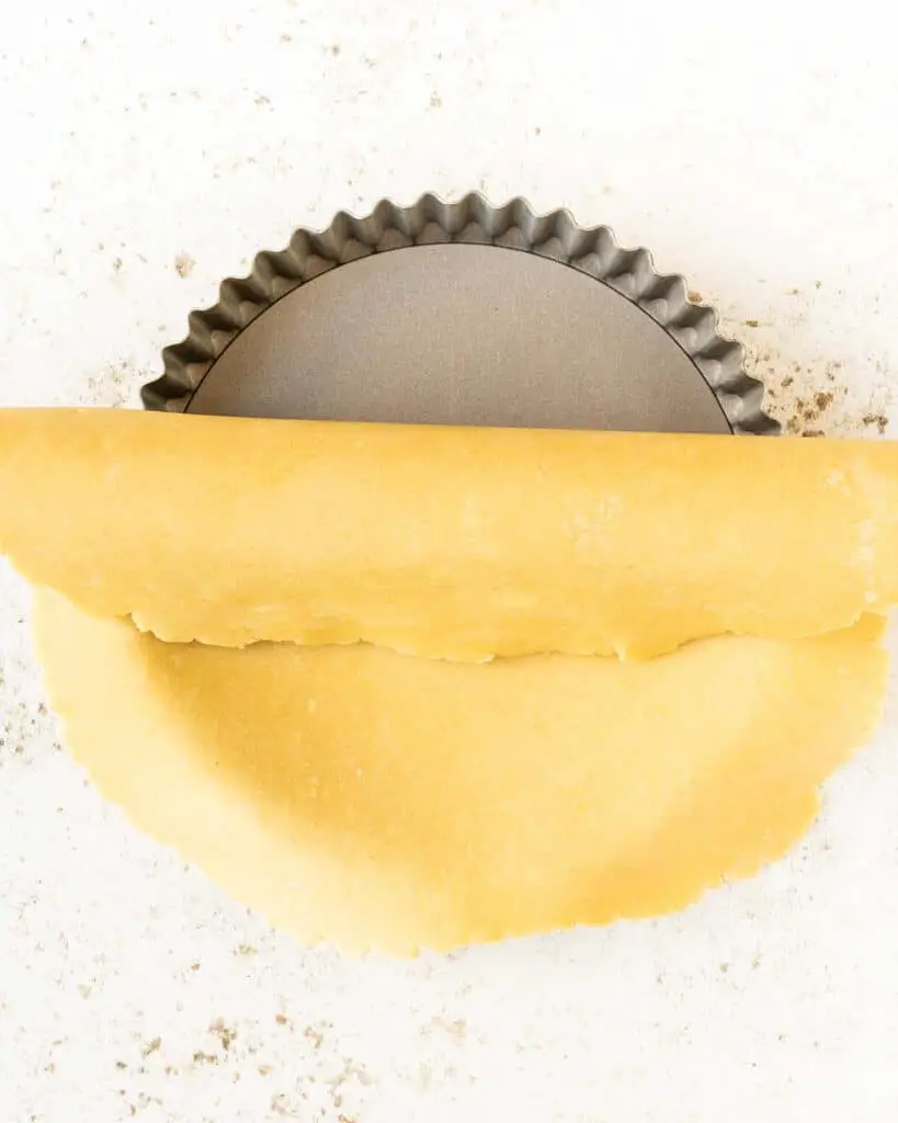 Place the rolled out pastry over the tart tin...