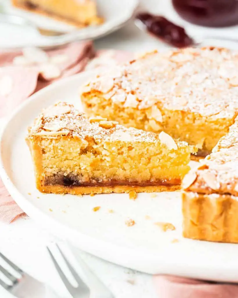 Biscuity shortcrust, rich raspberry jam and moreish frangipane all topped with flaked almonds, a traditional Bakewell Tart is utterly delish! Recipe by movers and bakers