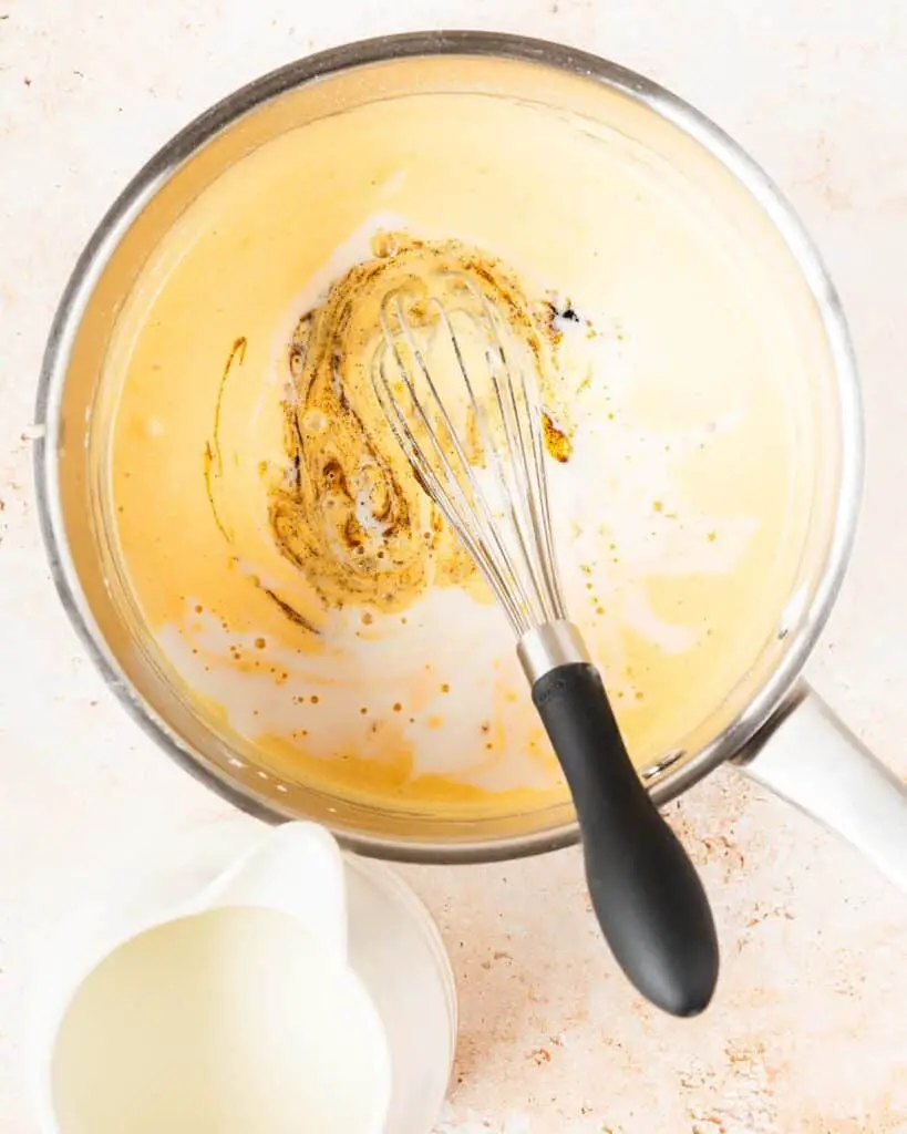 Before gradually whisking in the milk and vanilla ahead of cooking to thicken. Recipe by movers and bakers