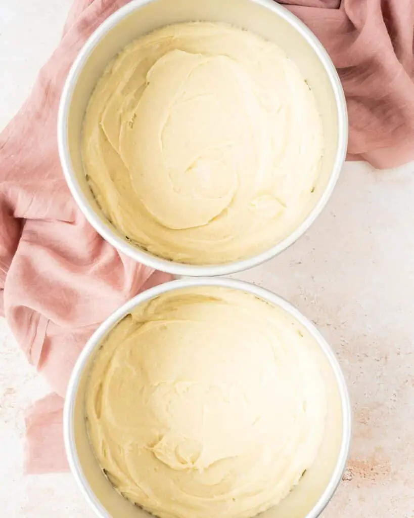 And then dividing between the tins before baking. Recipe by movers and bakers