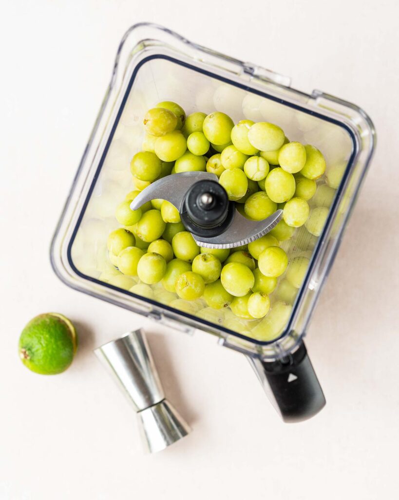 Once frozen, place the grapes with all the other ingredients into a high powered blender and blitz until completely smooth and creamy. Recipe by movers and bakers