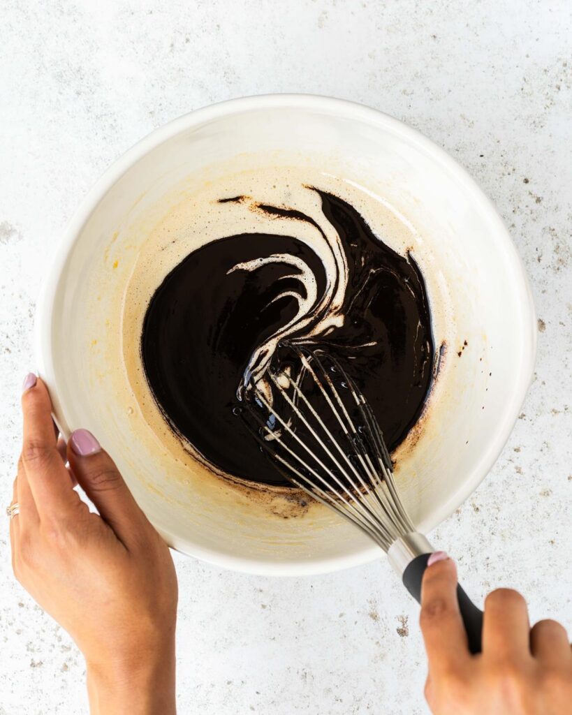 Whisking together the chocolate mixture with the eggs and sugar...