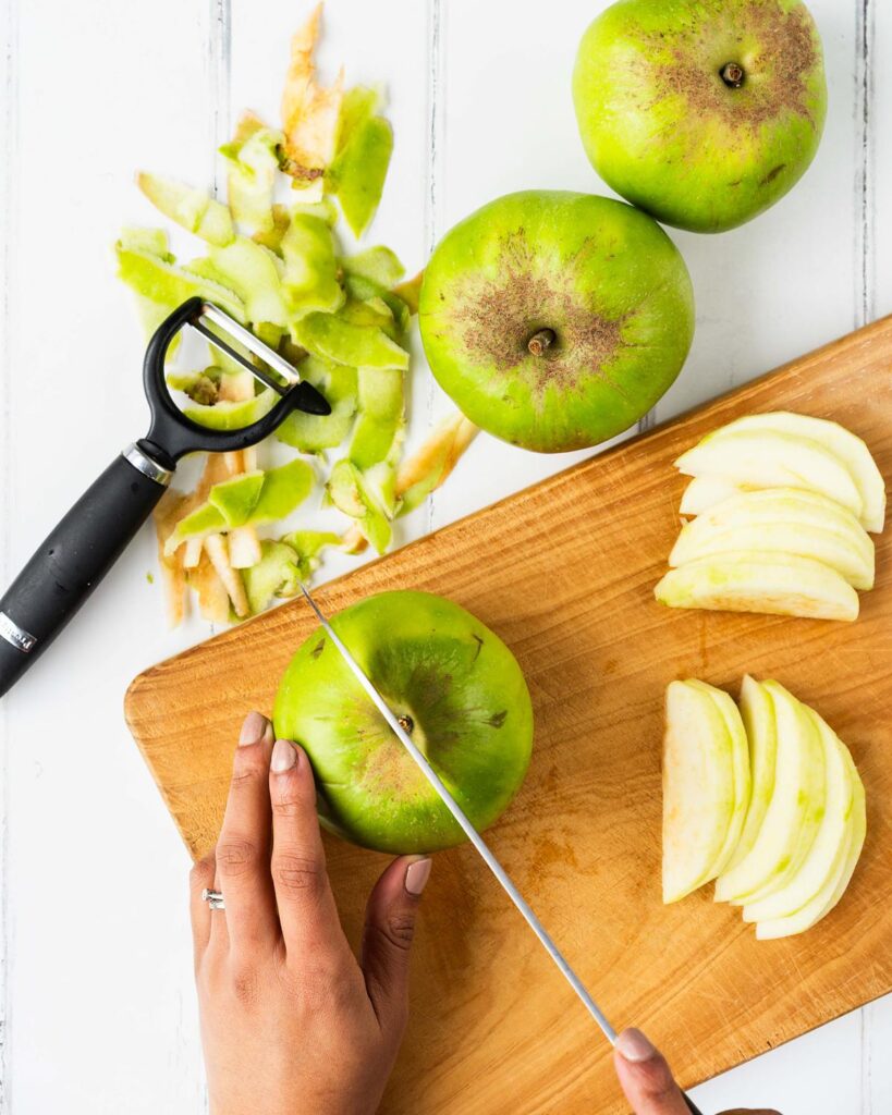 Peel, core and finely slicing the apples. Recipe by movers and bakers