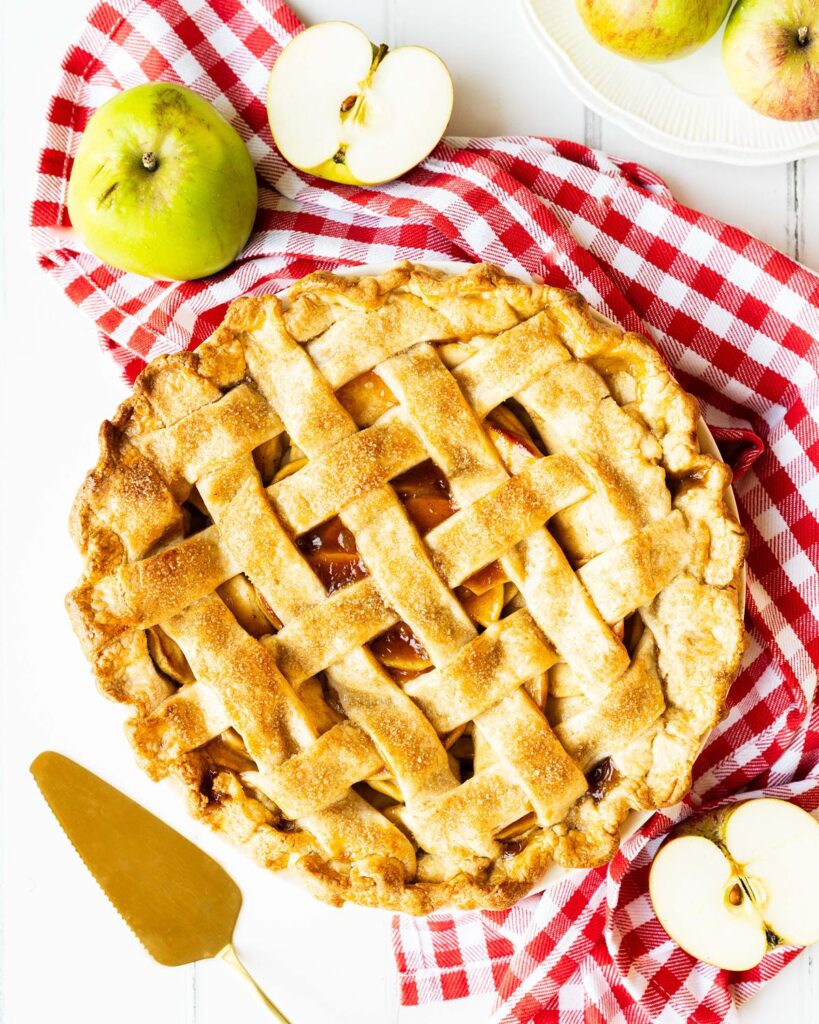 My apple pie is hearty, homely and always a popular dessert. Buttery shortcrust pastry filled with sweetly spiced apple filling topped with an adorable golden lattice crust. Recipe by movers and bakers.